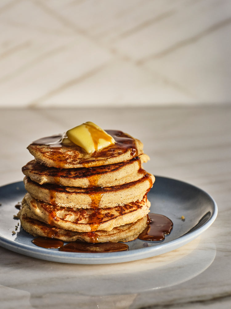griddle cakes with syrup and butter