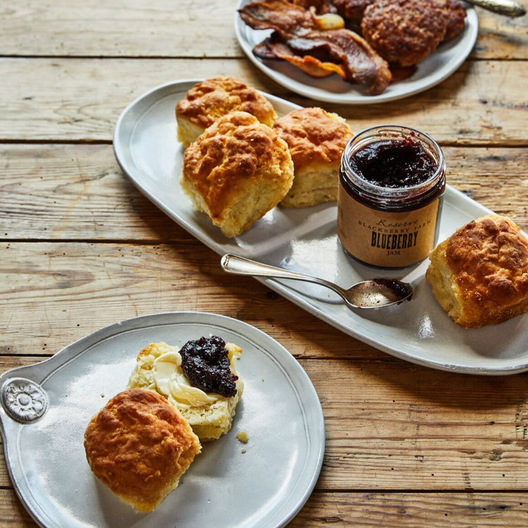 Biscuits with blueberry jam on a wooden table